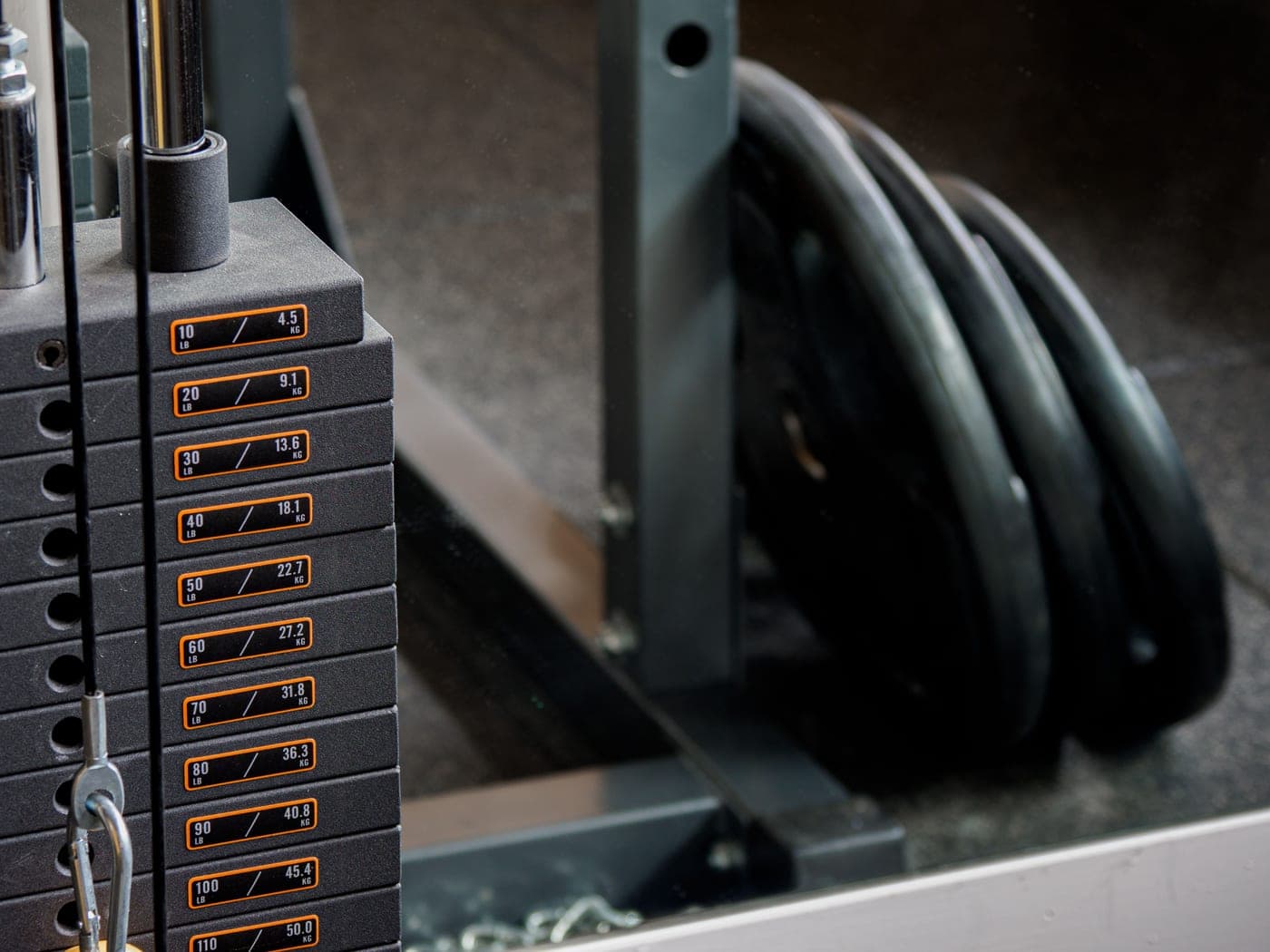 Cast iron weight plates stacked on a rack